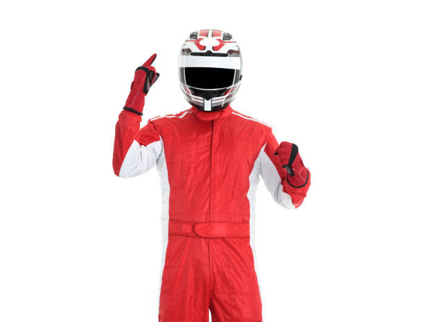 Cheerful and winning race car driver Race car driver celebrating victory on a white background race car driver stock pictures, royalty-free photos & images