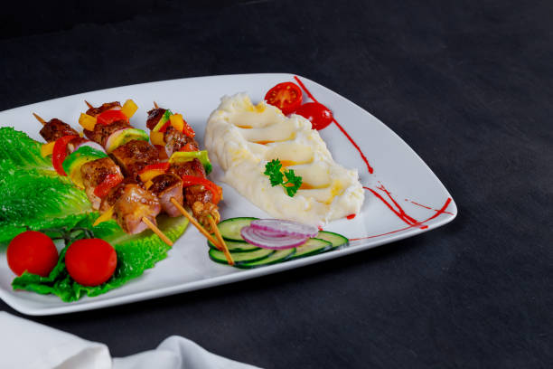 istock Pork skewers served with mashed potato 1093816896