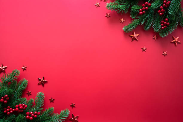 istock Christmas background concept. Top view of Christmas tree with spruce branches, pine cones, red berries and golden star on red background. 1093819314