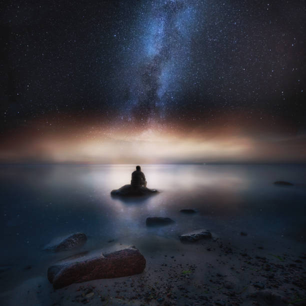 istock Surreal night seascape with man silhouette 1093828144