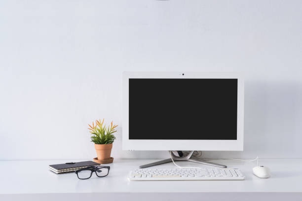 istock Empty screen computer monitor on desk office with copy space 1093834588