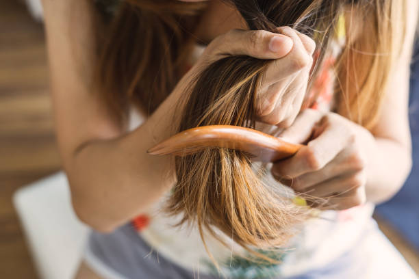 istock Woman combing tangled hair, Hair problems concept 1093837714