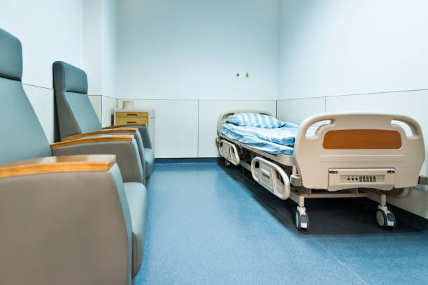 istock Hospital ward with bed and armchair 1093840428