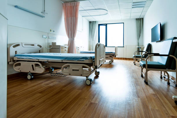 istock Hospital ward with beds and armchairs 1093840448