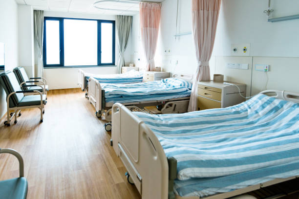 istock Hospital ward with beds and armchairs 1093840470