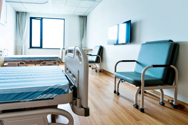 istock Hospital ward with beds and armchairs 1093840490
