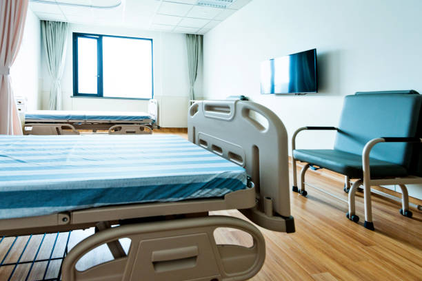 istock Hospital ward with beds and armchairs 1093840500