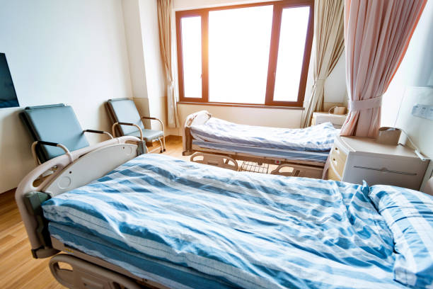 istock Hospital ward with beds and armchairs 1093840520
