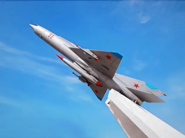 Photo of MiG-21 aircraft on a pedestal.