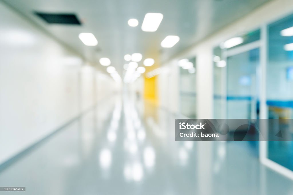Defocused empty corridor in a hospital Defocused empty corridor in a hospital. Hospital Stock Photo