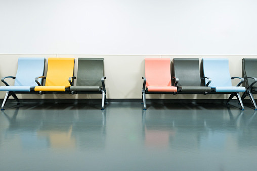 Colorful seats in hospital corridor.