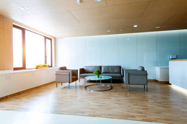 Reception table and armchairs on hospital lobby.