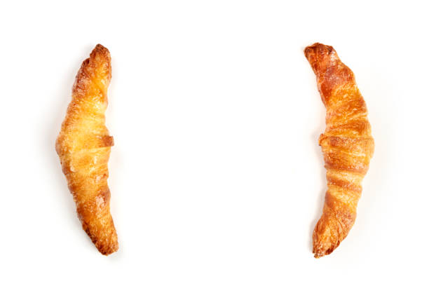 istock Two croissants on a white background, shot from the top, forming a frame for copy space 1093851042