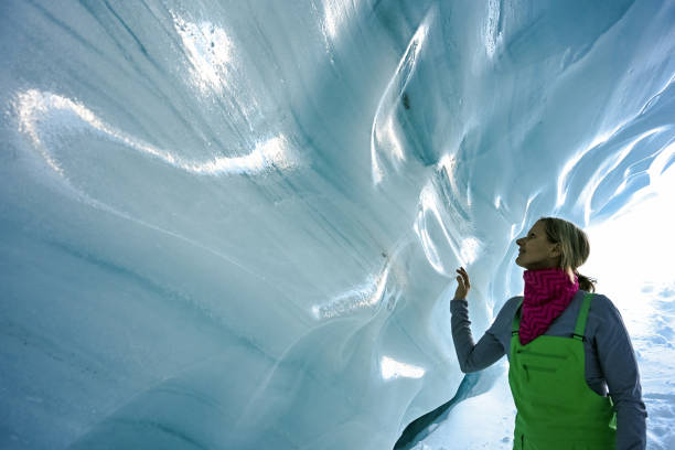 istock Woman exploring a glacial ice cave 1093855812