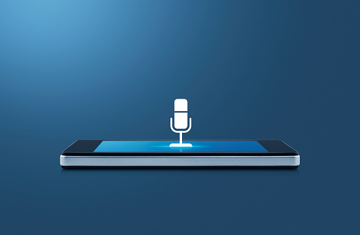 Microphone flat icon on modern smart mobile phone screen on wooden table over gradient light blue background, Business communication online concept