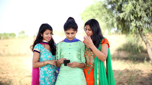 istock Indian girls using smartphone 1093862954