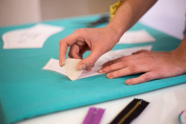 istock Seamstress woman preparing material 1093864768