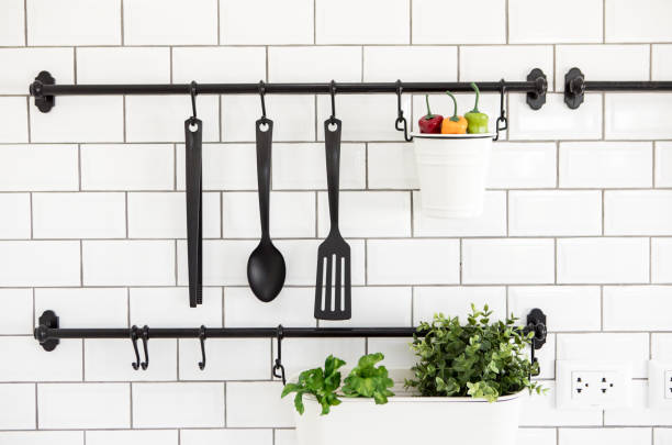 istock kitchen utensil hanger on white brick wall 1093871556