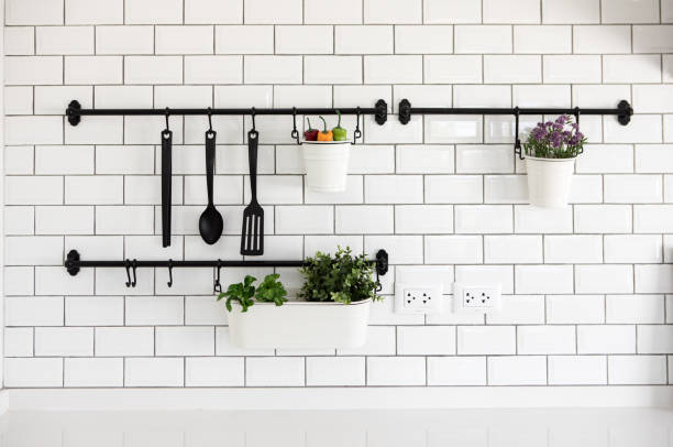 istock kitchen utensil hanger on white brick wall 1093871564