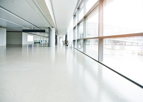 Empty corridor in airport building.