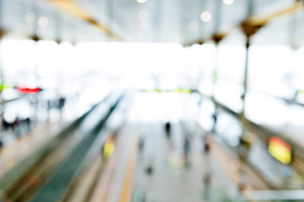 Blurred background of passengers on station platform.