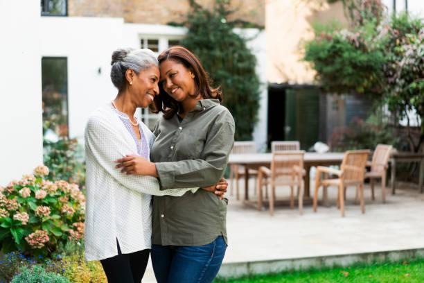 istock Smiling woman embracing mother at back yard 1093875188
