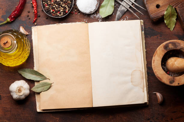 istock Set of various spices and herbs and cookbook 1093875618