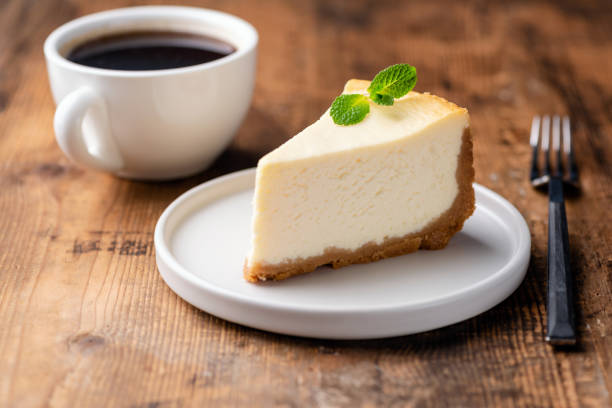istock Cheesecake and cup of coffee on wooden table 1093880312