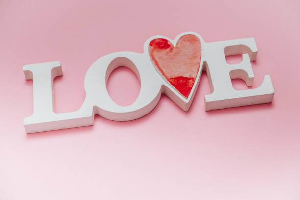 istock Single word LOVE with wooden hearts 1093883290
