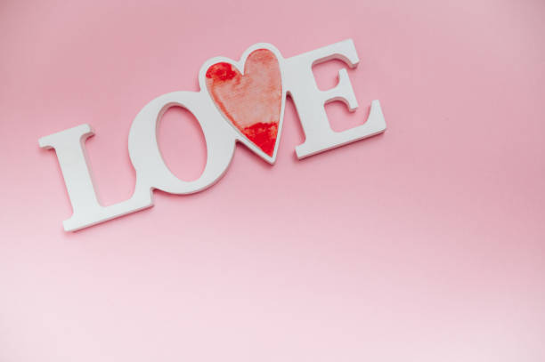 istock Single word LOVE with wooden hearts 1093883562