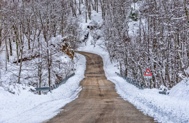 istock Winter road with snow 1093883688