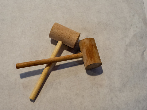 Two crab mallets sitting on paper table cover prepared for seafood meal