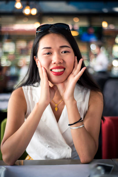 istock Cheerful asian girl at the restaurant 1093885036