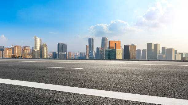 istock Asphalt road and city skyline in hangzhou,high angle view 1093885384
