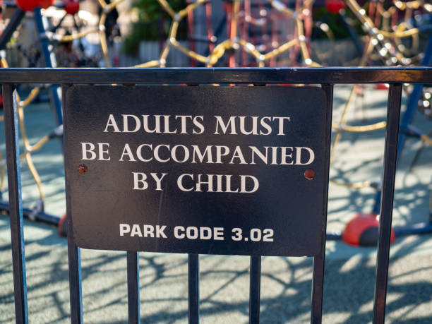 istock Adults must be accompanied by child park warning sign 1093885510