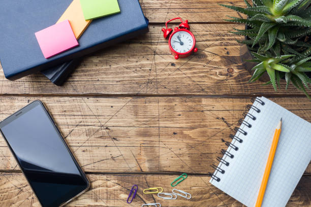 istock Pencil and notepad with spiral on wooden textured table Concept office and school. Selective focus. Copy space. 1093892684