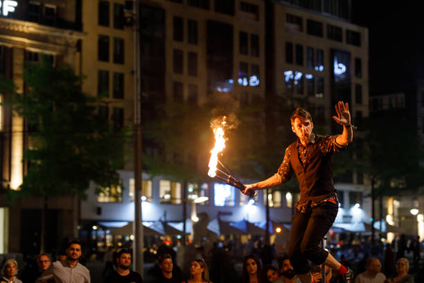 Amsterdam, Netherlands - September 4, 2018: A street performer entertains the crowd in Dam Square, Amsterdam.