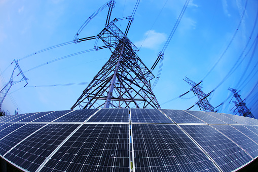 Pylon and photovoltaic panels in the evening