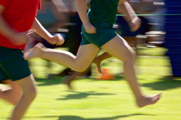 istock Low Section children running track and field 1093898040
