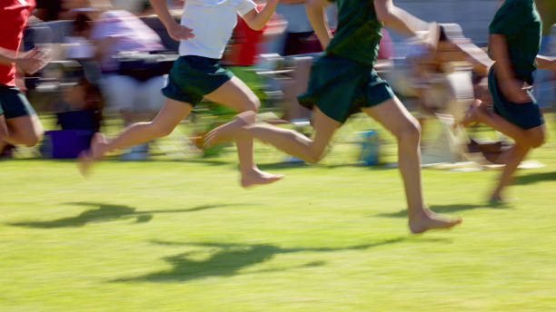 istock Low Section children running track and field 1093898042
