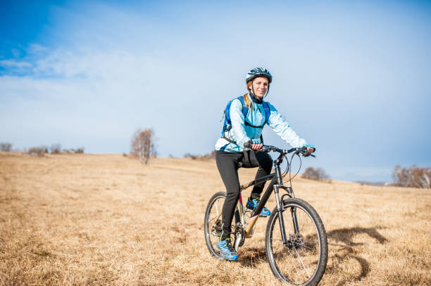 istock Smiling Female Cross-Country Cycler 1093898834