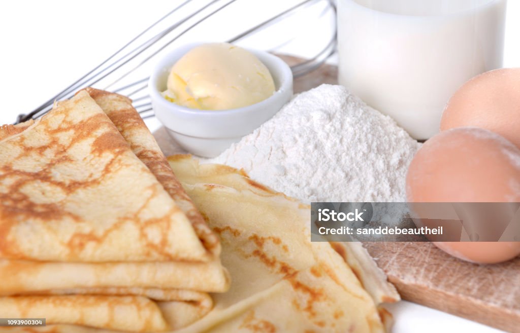 french pancakes with ingredient homemade french pancakes with eggs, flour, butter and milk Batter - Food Stock Photo