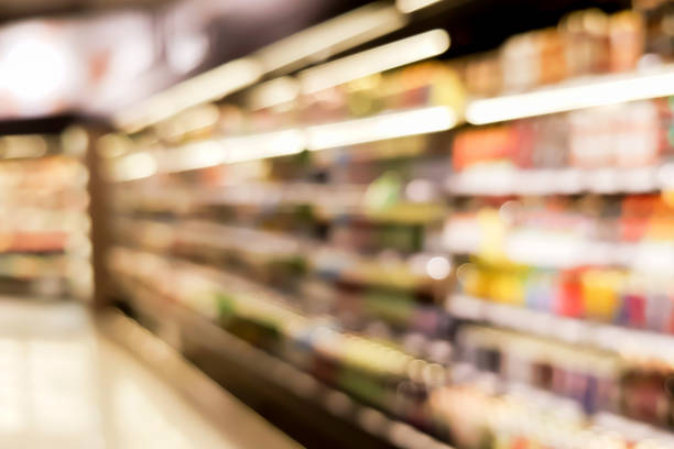 abstract blurred inside interior of local supermarket corridor path with aisle distribution shelf in freezer food and . drink zone for background design concept - food and drink industry imagens e fotografias de stock