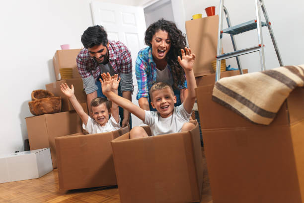 istock Happy young family having fun while moving into their new home. 1093901162