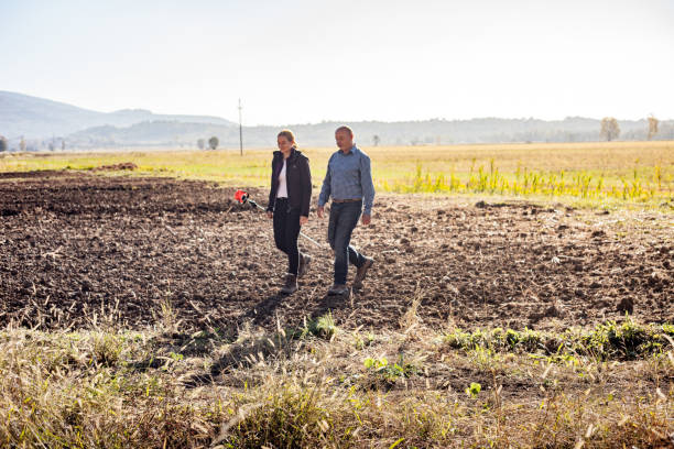 istock Surveyors Walking on Field and Preparing for Measuring 1093901358