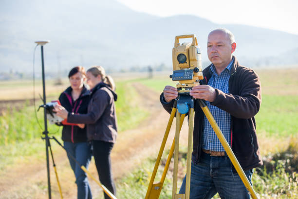 istock Surveyor Measuring With Theodolite Outdoors 1093901454