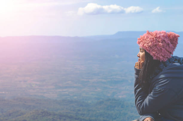 istock Silhouette woman sitting on mountain. 1093909844