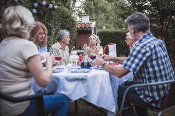 istock Senior people, friends, enjoying backyard barbecue 1093914526