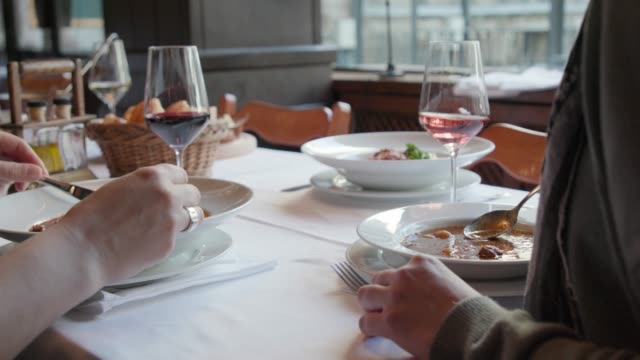 A toast with wine over lunch in a restaurant