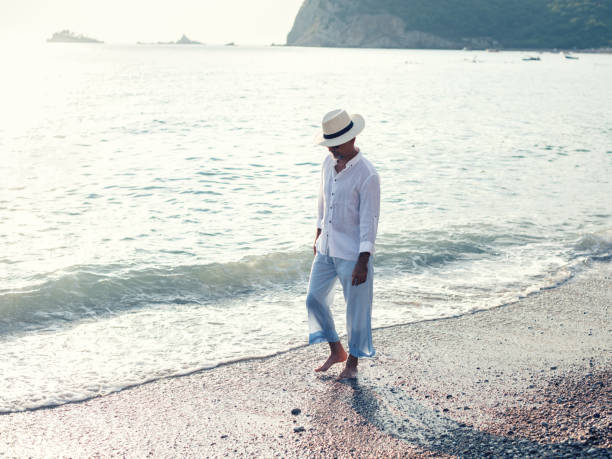 istock Enjoying a walk on the beach 1093914756